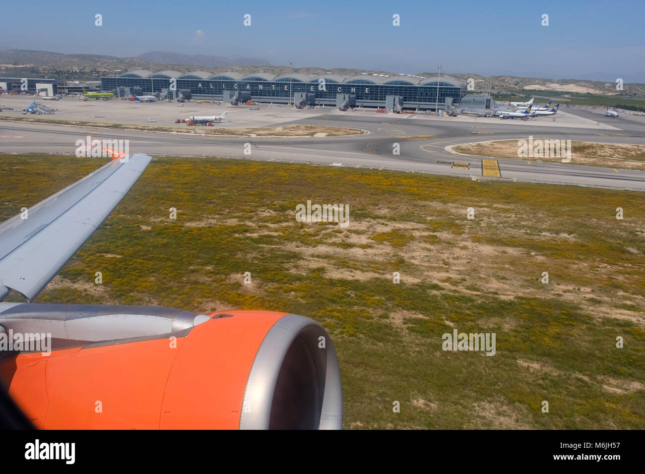 View from aircraft of engine and part of Alicante airport, Spain. Stock Photo