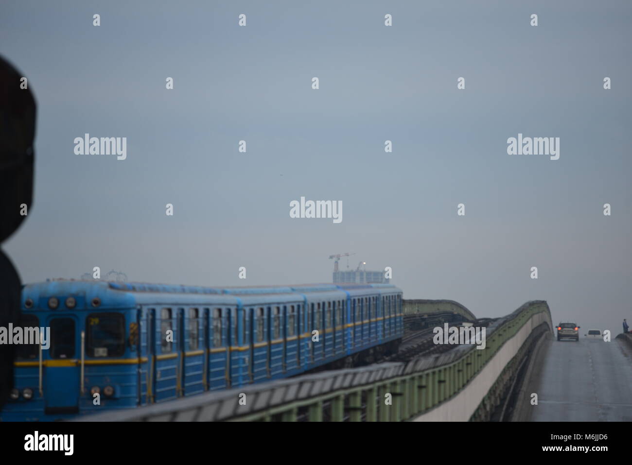 The Metro Bridge over Dnipro river, Kyiv, Ukraine in  the foggy morning Stock Photo
