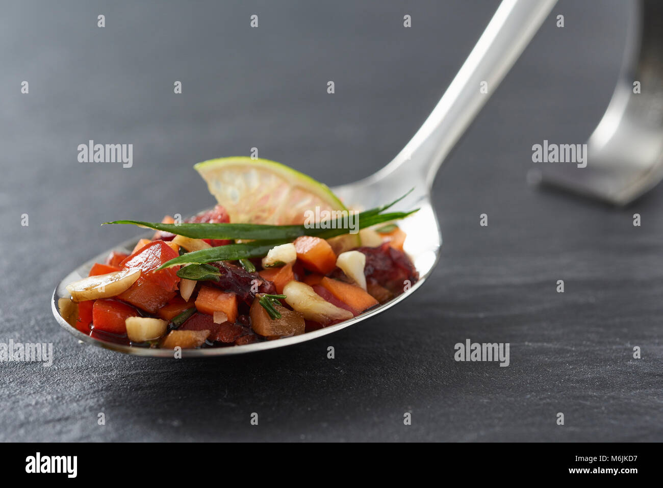 little delicious appetizer on a happy spoon Stock Photo Alamy