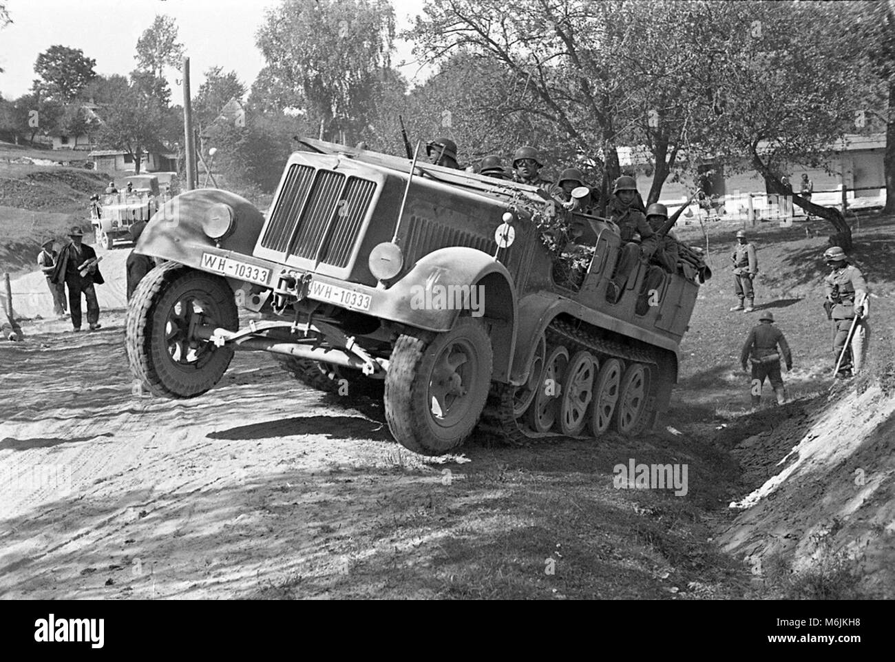 German Wehrmacht troops in SdKfz 6 half-track military vehicle near Sambor Poland in 1939 during the Invasion of Poland. The area is now called Sambir in the Ukraine. Stock Photo