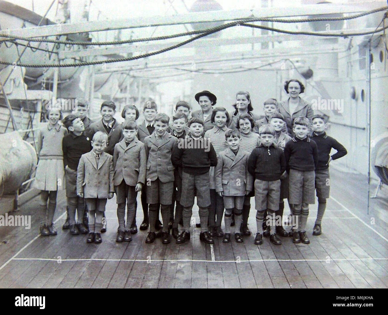 Children bound for Western Australia under the Child Migration Programme aboard the cruise ship RMS Ormonde at Tilbury docks 18th December 1948: Stock Photo