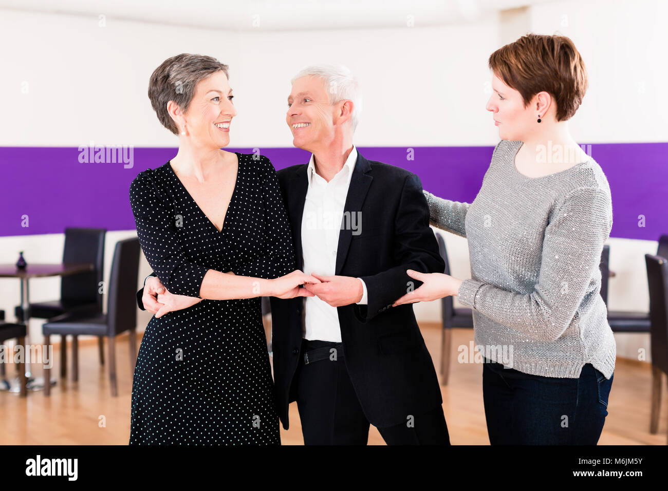 Dance instructor with senior couple Stock Photo