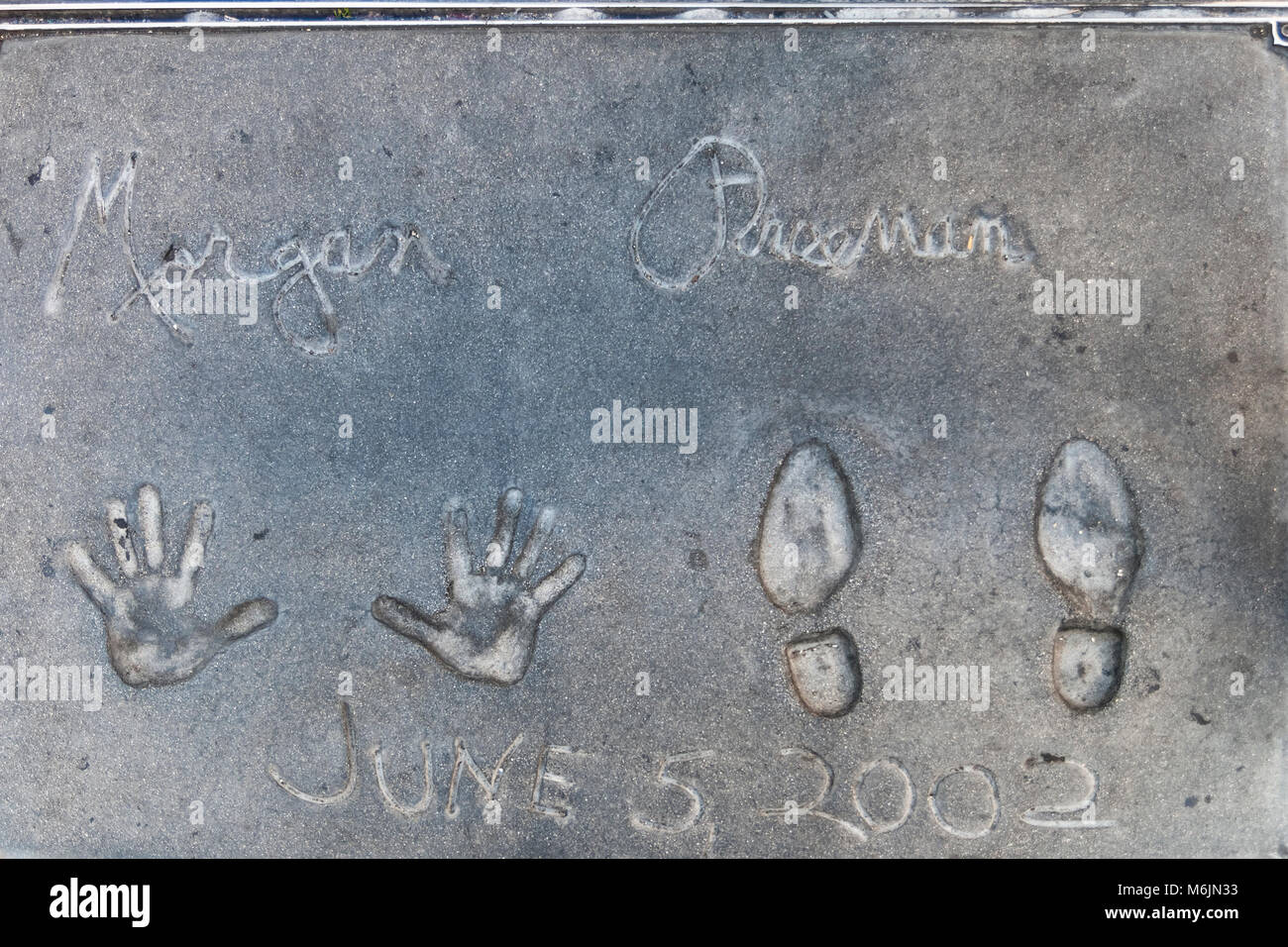 HOLLYWOOD, CALIFORNIA - JULY 19, 2007: Handprints and footprints of the famous american actor Morgan Freeman on the ground behind the TCL Grauman's Ch Stock Photo