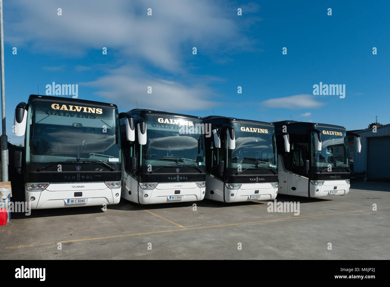 Coaches parked in the yard of Galvins Coach Company, Dunmanway, County Cork, Ireland with copy space. Stock Photo