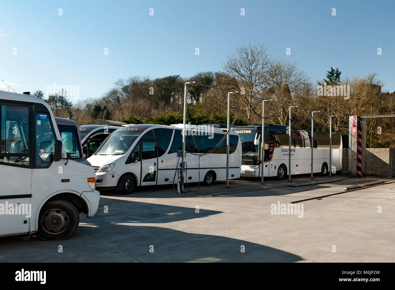 Coaches parked in the yard of Galvins Coach Company, Dunmanway, County Cork, Ireland with copy space. Stock Photo