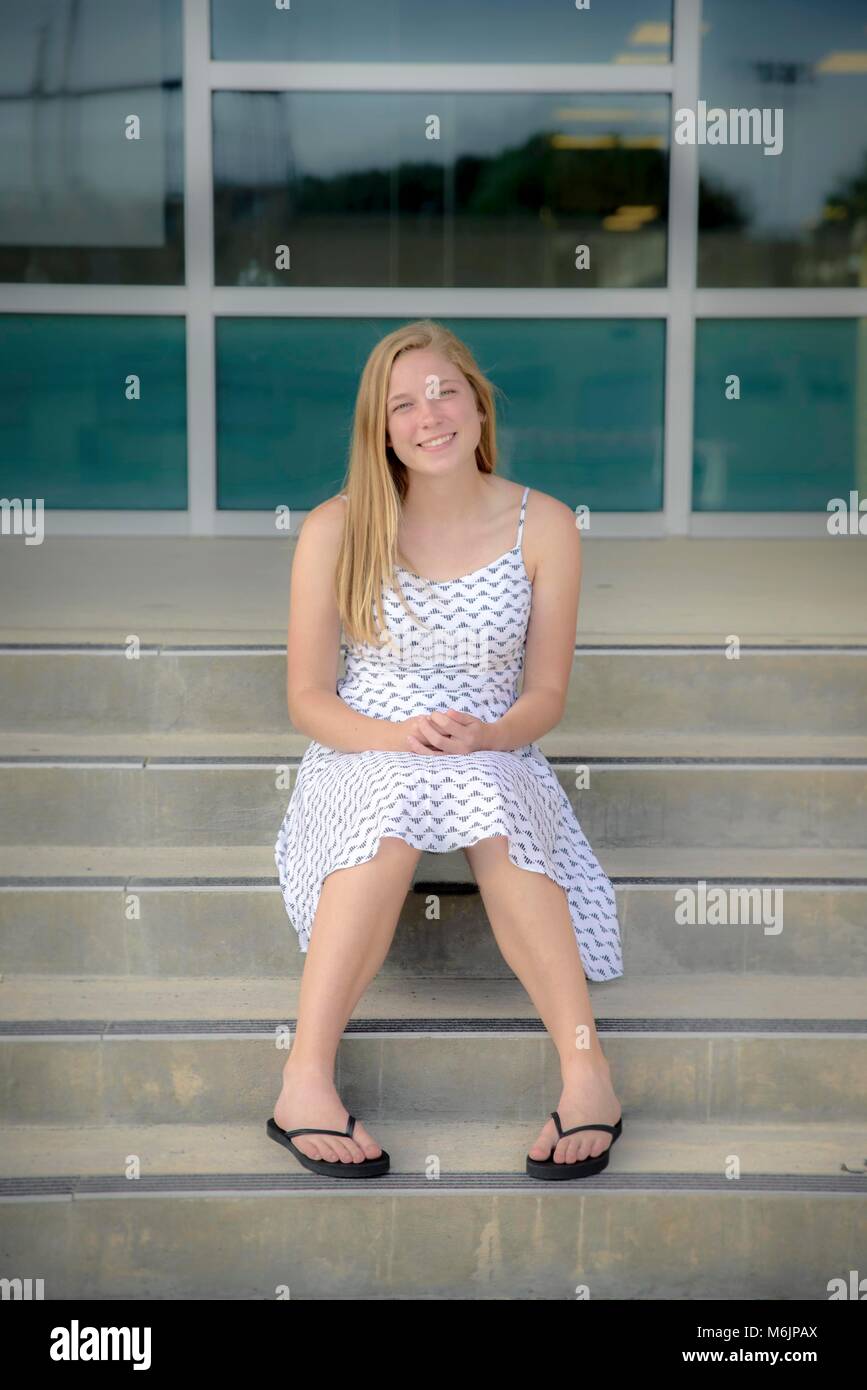 Teenage girl  sitting on High School steps Stock Photo