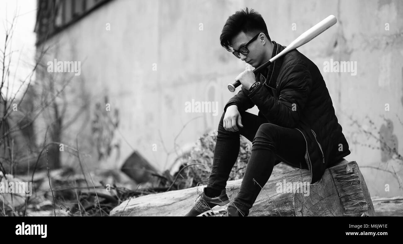 Black White photo of Asian young man outdoors posing Stock Photo - Alamy