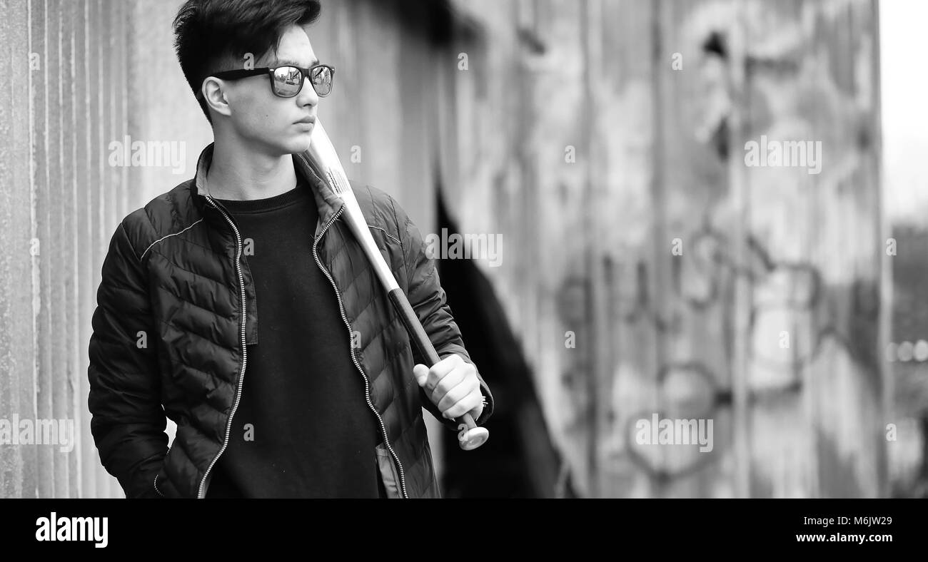Black White photo of Asian young man outdoors posing Stock Photo - Alamy