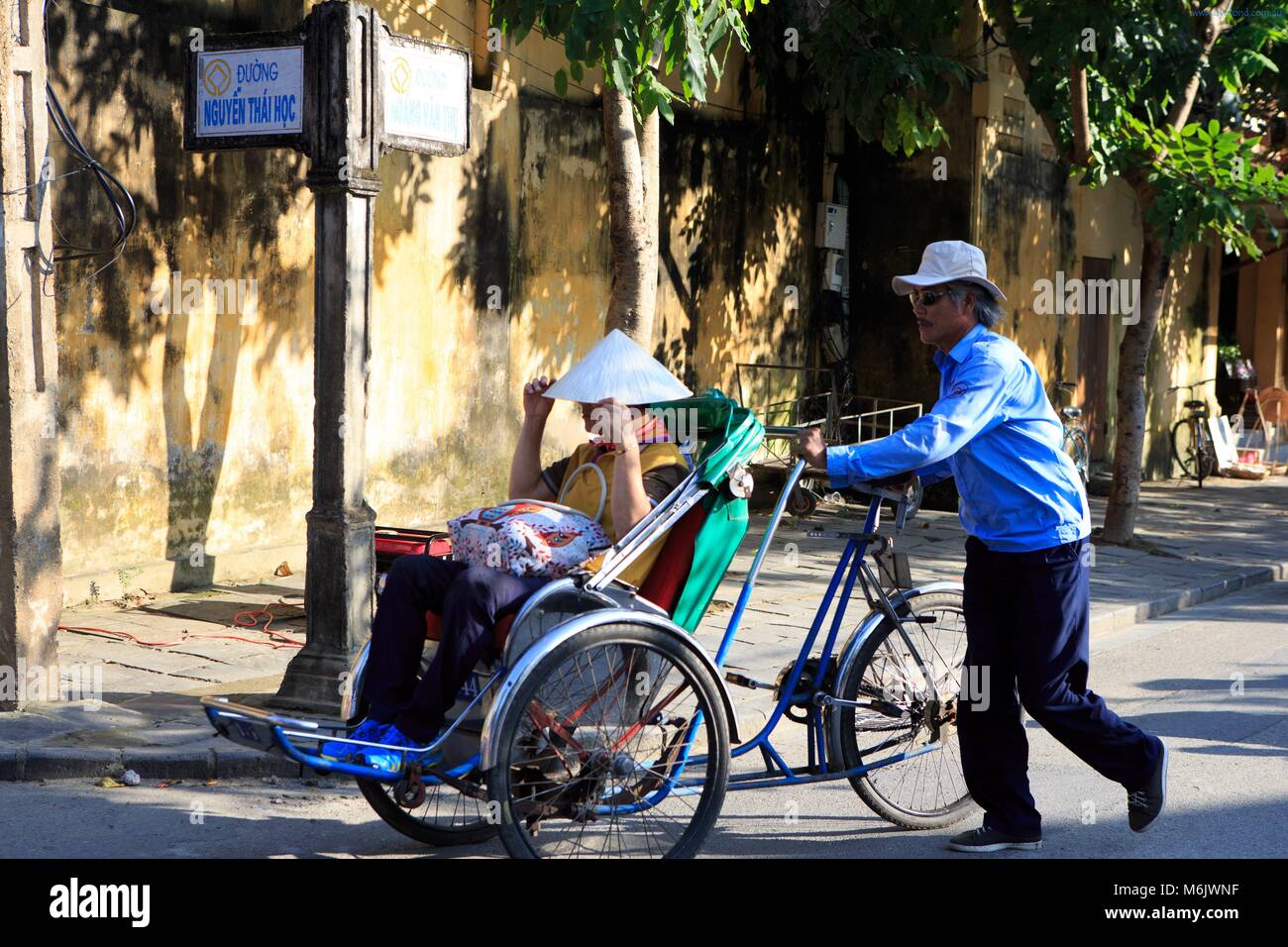 Tricycle rickshaws are a popular way for tourists to travel through the