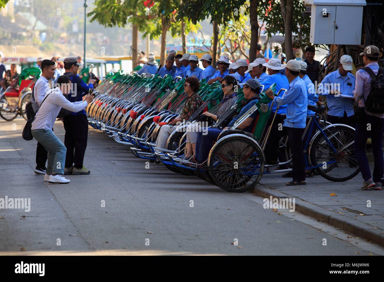 Tricycle rickshaws are a popular way for tourists to travel through the