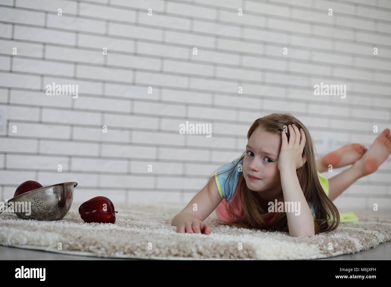 little girl lies on the floor Stock Photo - Alamy
