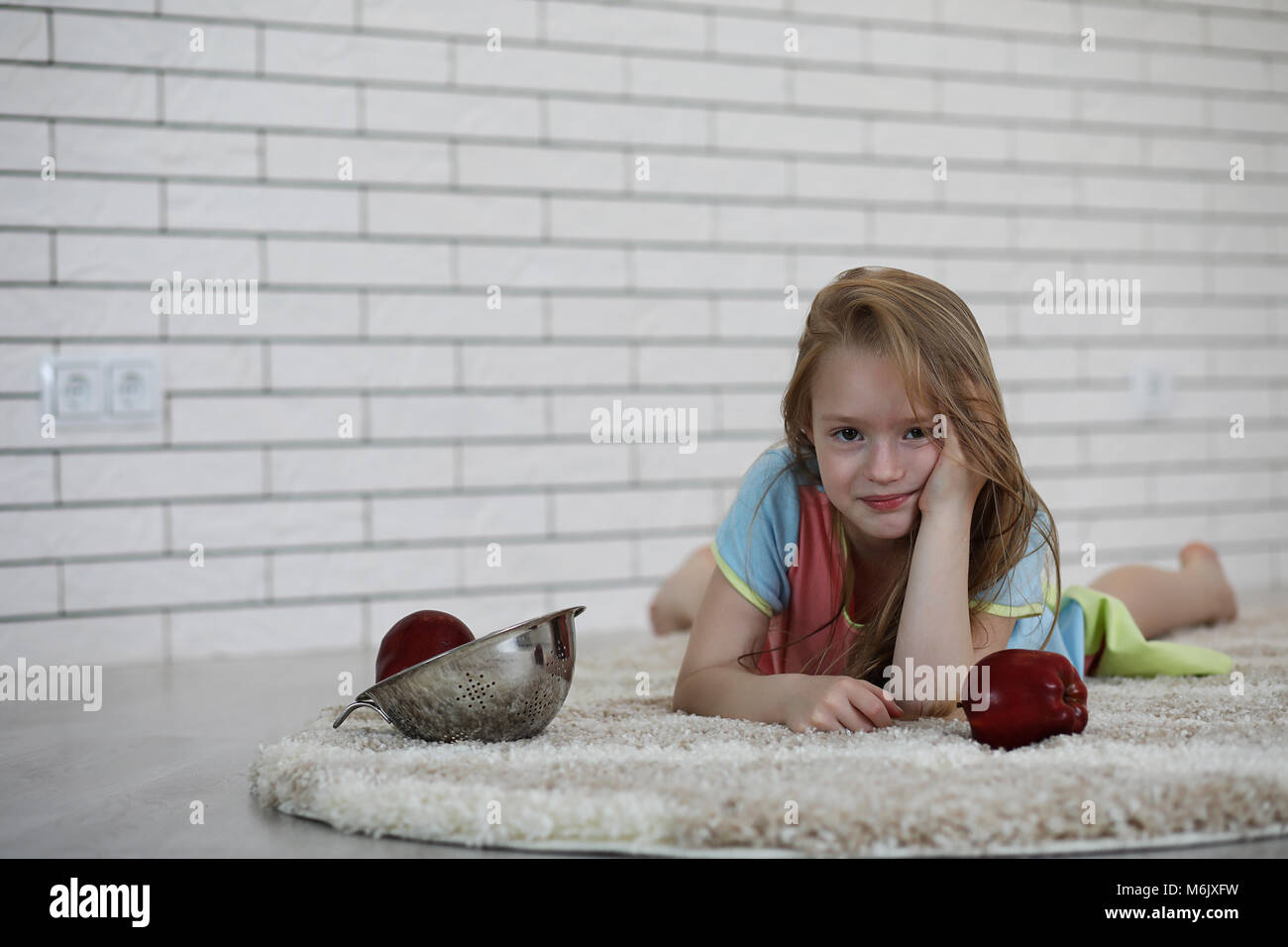 little girl lies on the floor Stock Photo - Alamy