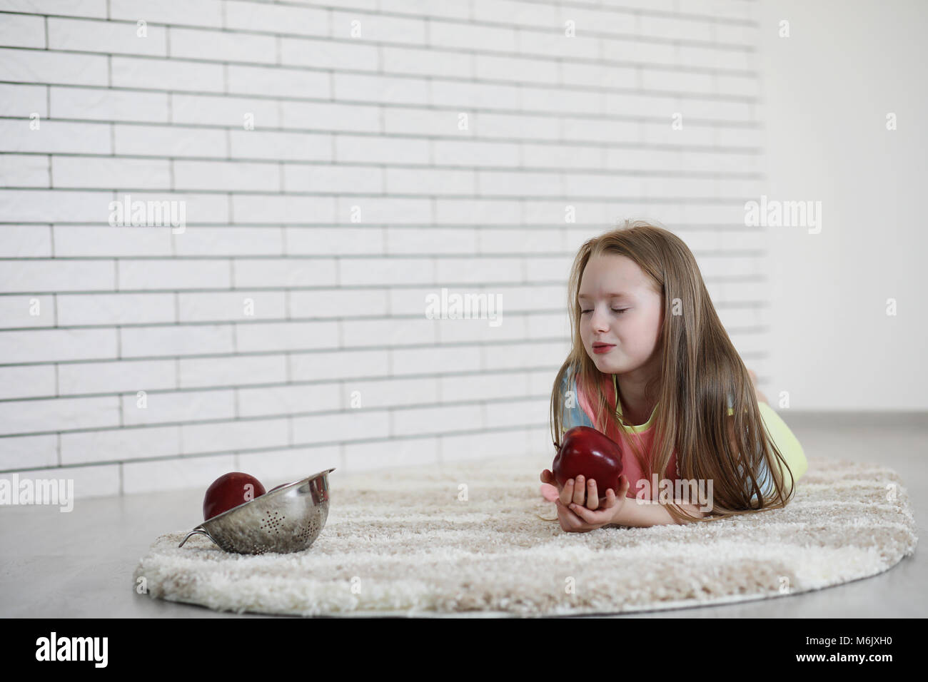 little girl lies on the floor Stock Photo - Alamy