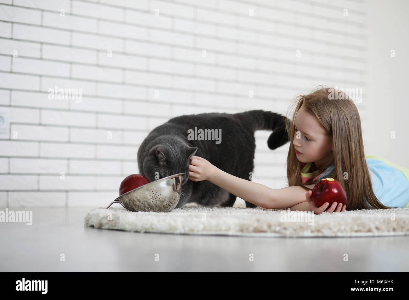 little girl lies on the floor Stock Photo - Alamy