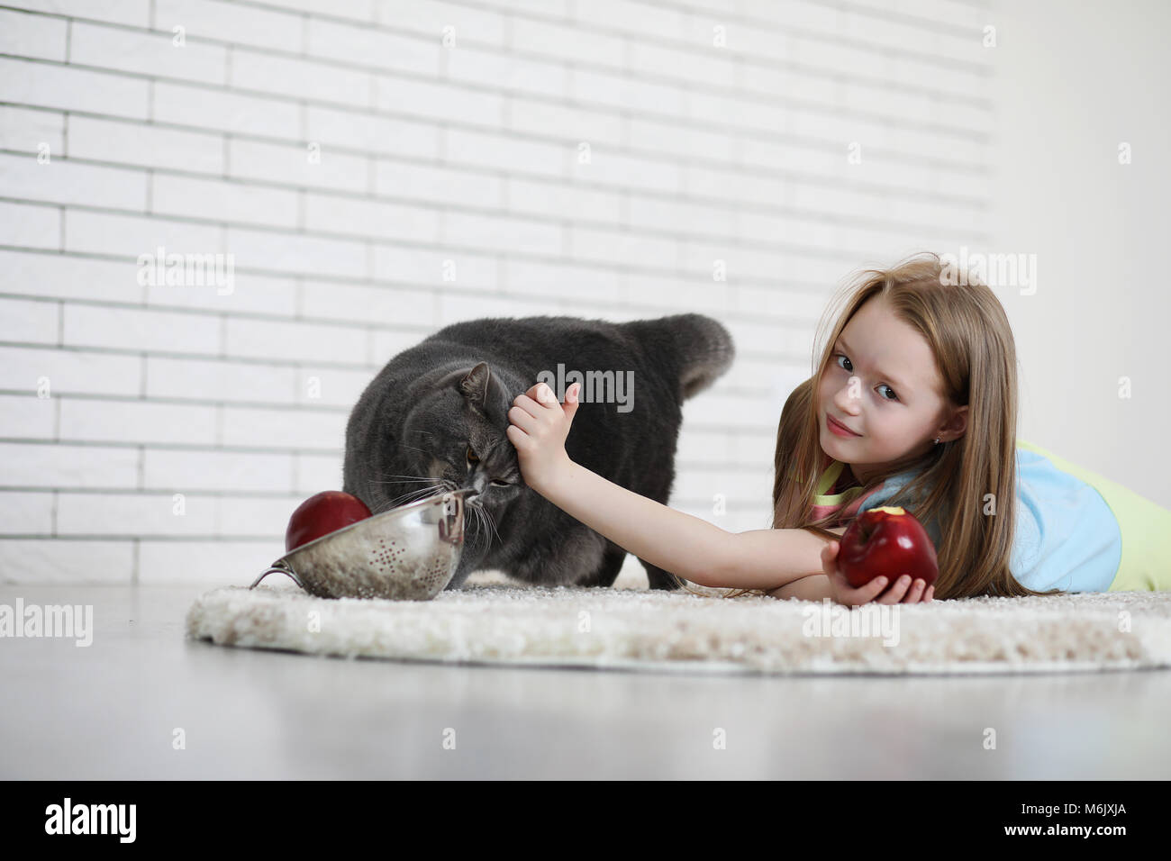 little girl lies on the floor Stock Photo - Alamy