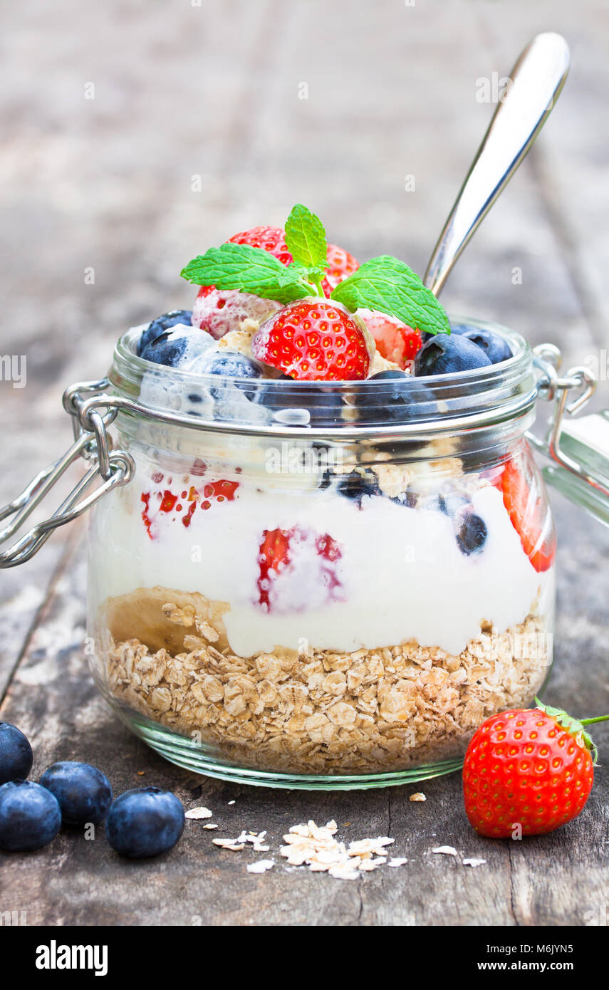 fresh yogurt with oat flakes and berries Stock Photo Alamy