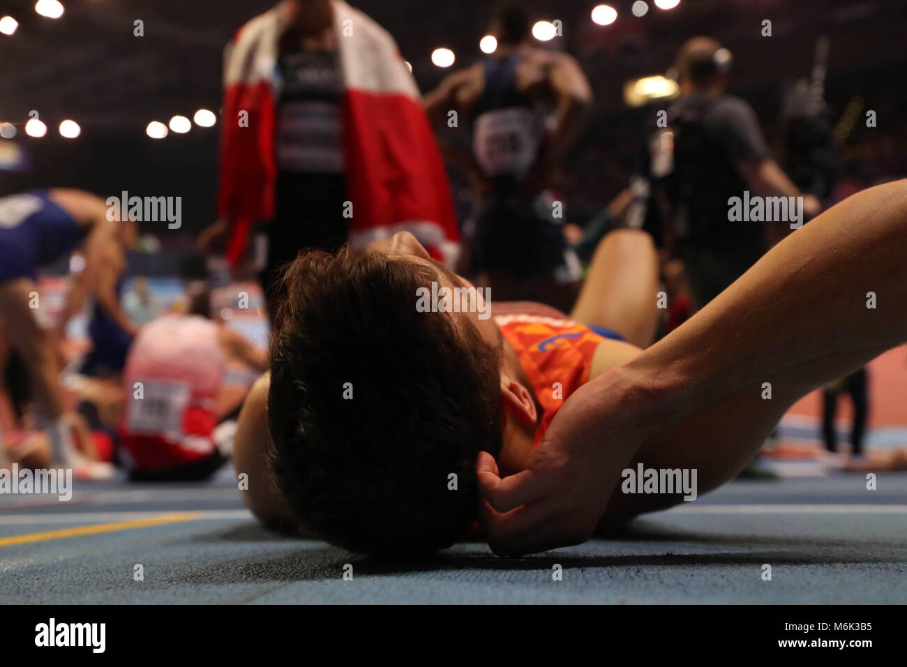 Birmingham, UK. 3rd Mar, 2018. IAAF World Indoor Championships.a dutch athlete lies on the track after the heptathlon. Credit: Ben Booth/Alamy Live News Stock Photo