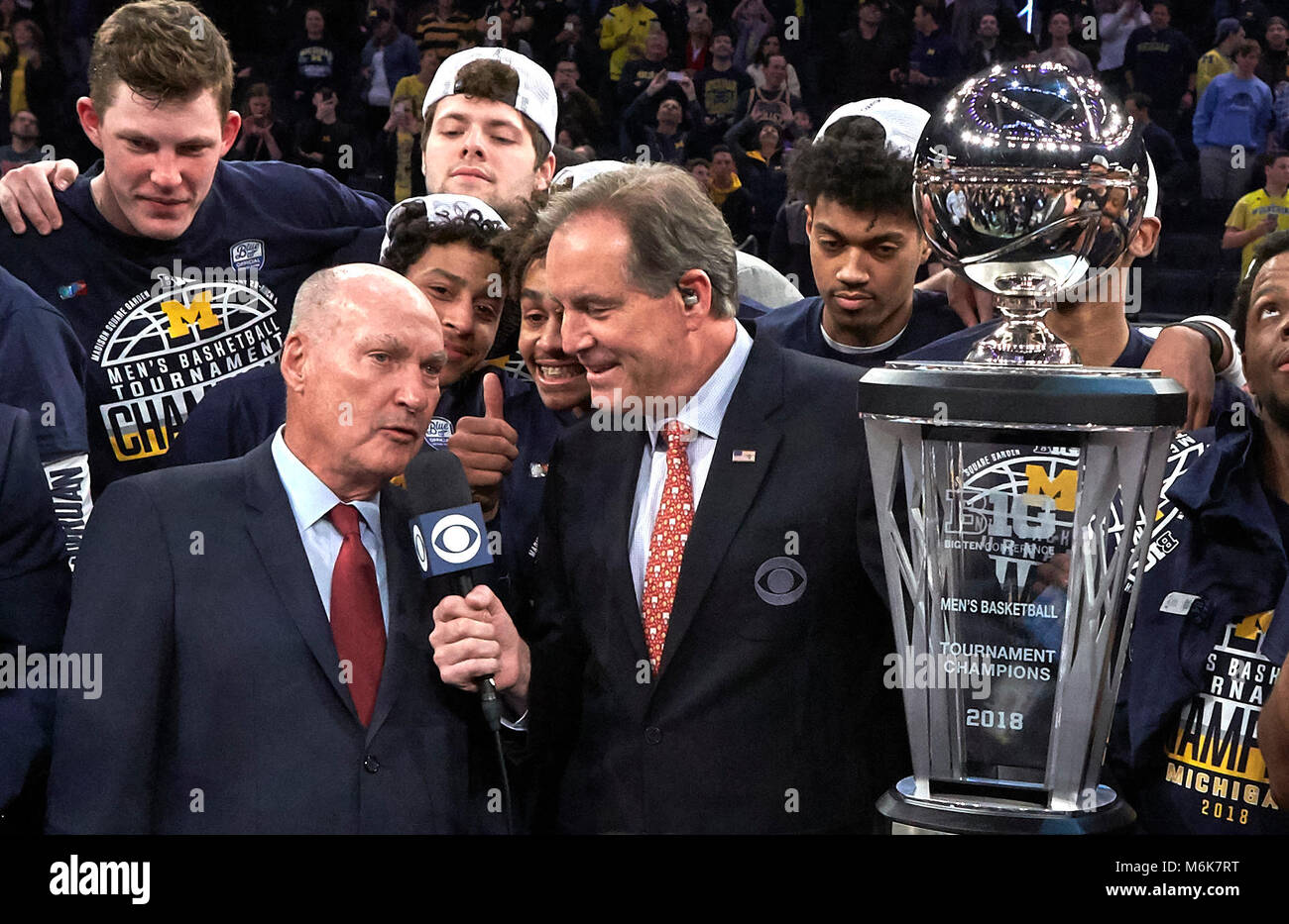 New York, New York, USA. 4th Mar, 2018. Big Ten Commissioner Jim Delany talks with CBS sportscaster Jim Nantz after Michigan defeated the Purdue Boilermakers 75-66 to win the 2018 Big 10 Conference Men's Basketball Championship at Madison Square Garden in New York City. Duncan Williams/CSM Duncan Williams/CSM/Alamy Live News Stock Photo