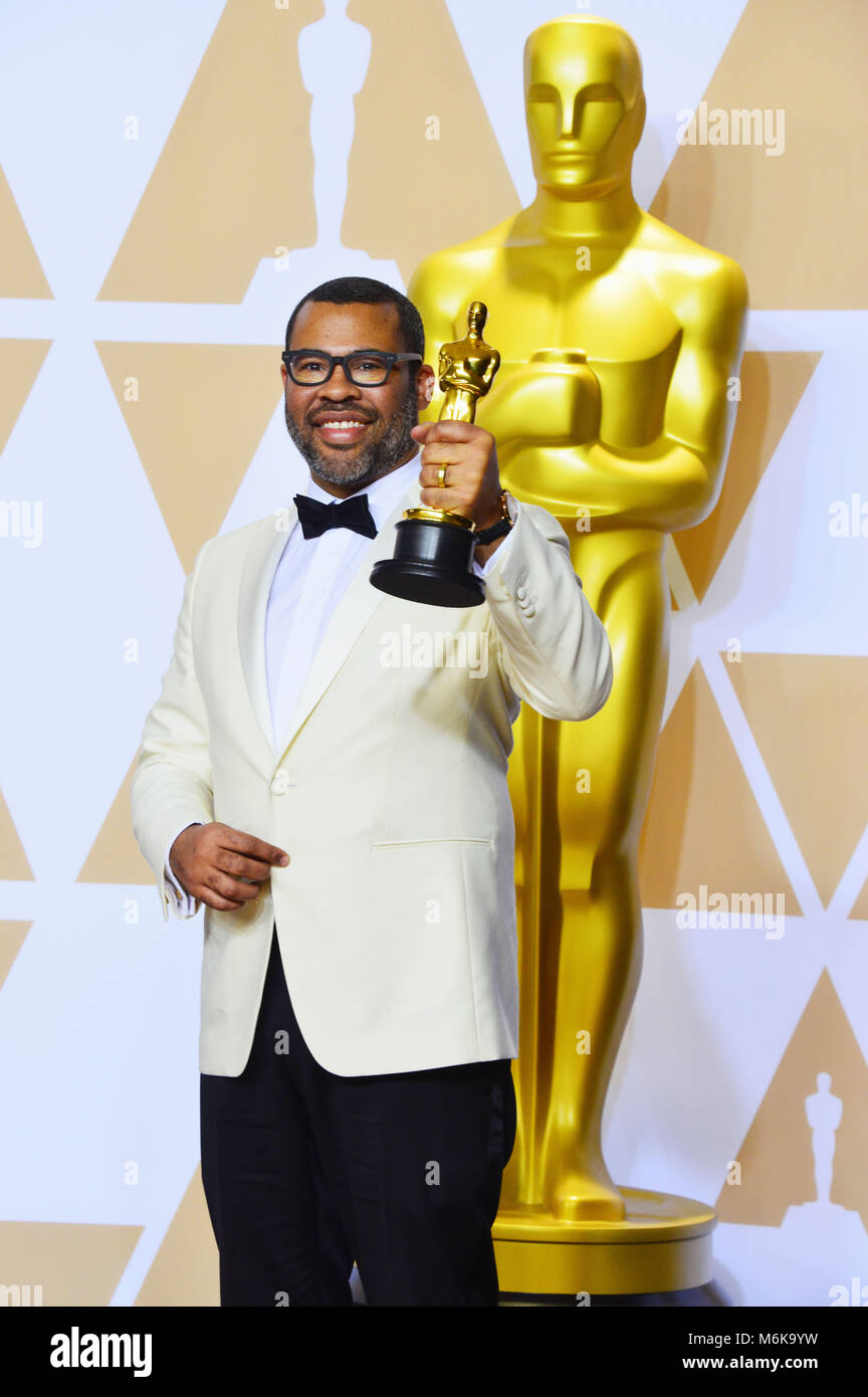 Los Angeles, California, USA. 4th March, 2018. Writer Jordan Peele, winner of the Best Original Screenplay award for 'Get Out,' poses in the press room during the 90th Annual Academy Awards at Hollywood & Highland Center on March 4, 2018 in Hollywood, California. Credit: Tsuni / USA/Alamy Live News Stock Photo