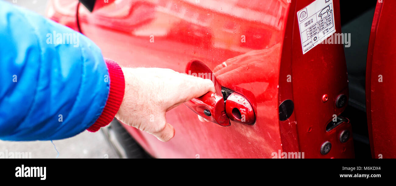 Married Man Is Opening Front Door Of His Red Dirty Car