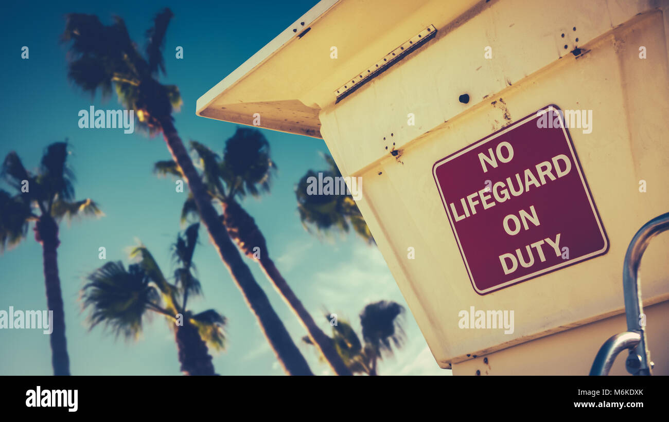 Retro Image Of A Lifeguard Station Or Tower On A Beach In California With Palm Trees Stock Photo