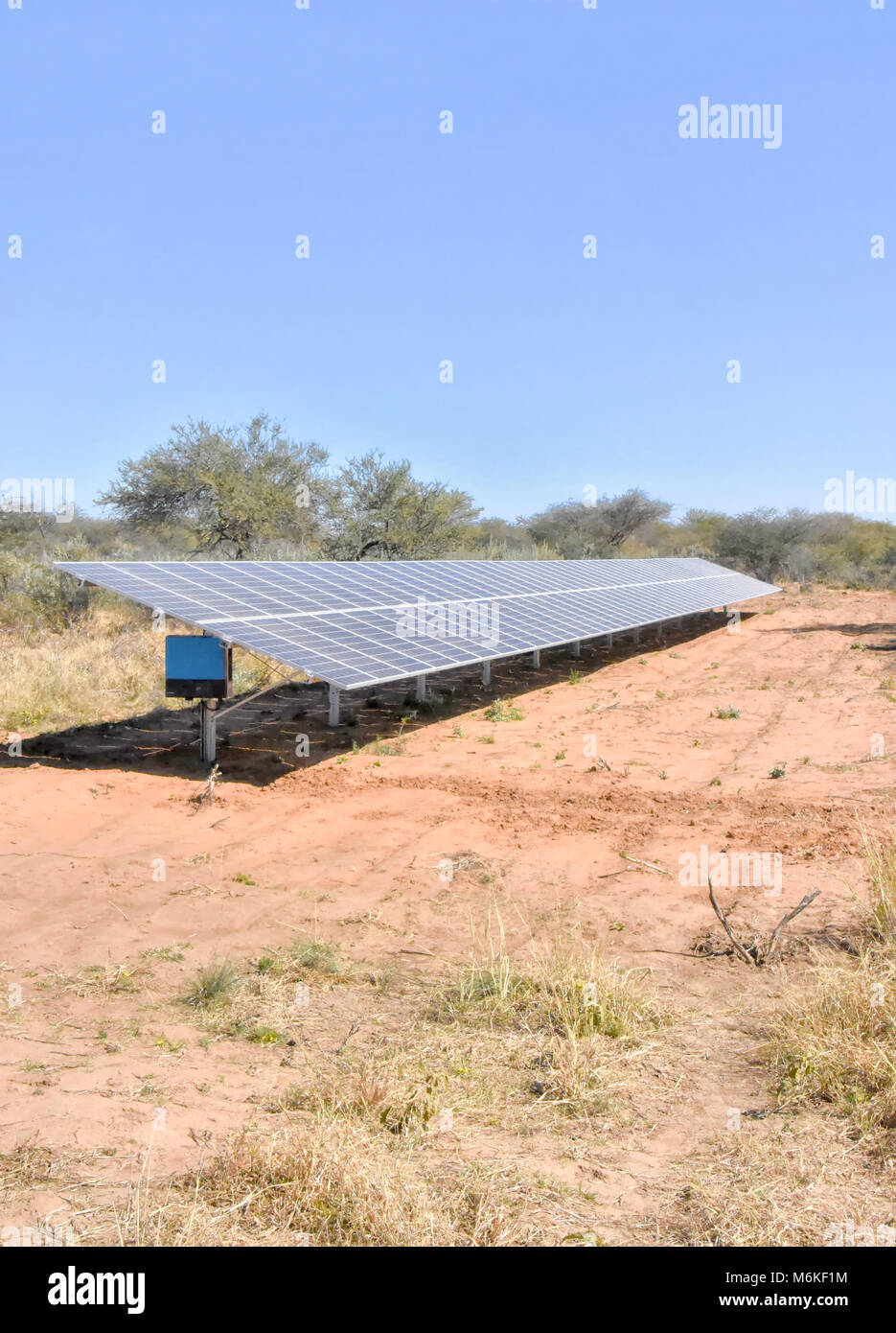 A large array of solar panels in Namibia placed in a wildlife refuge to