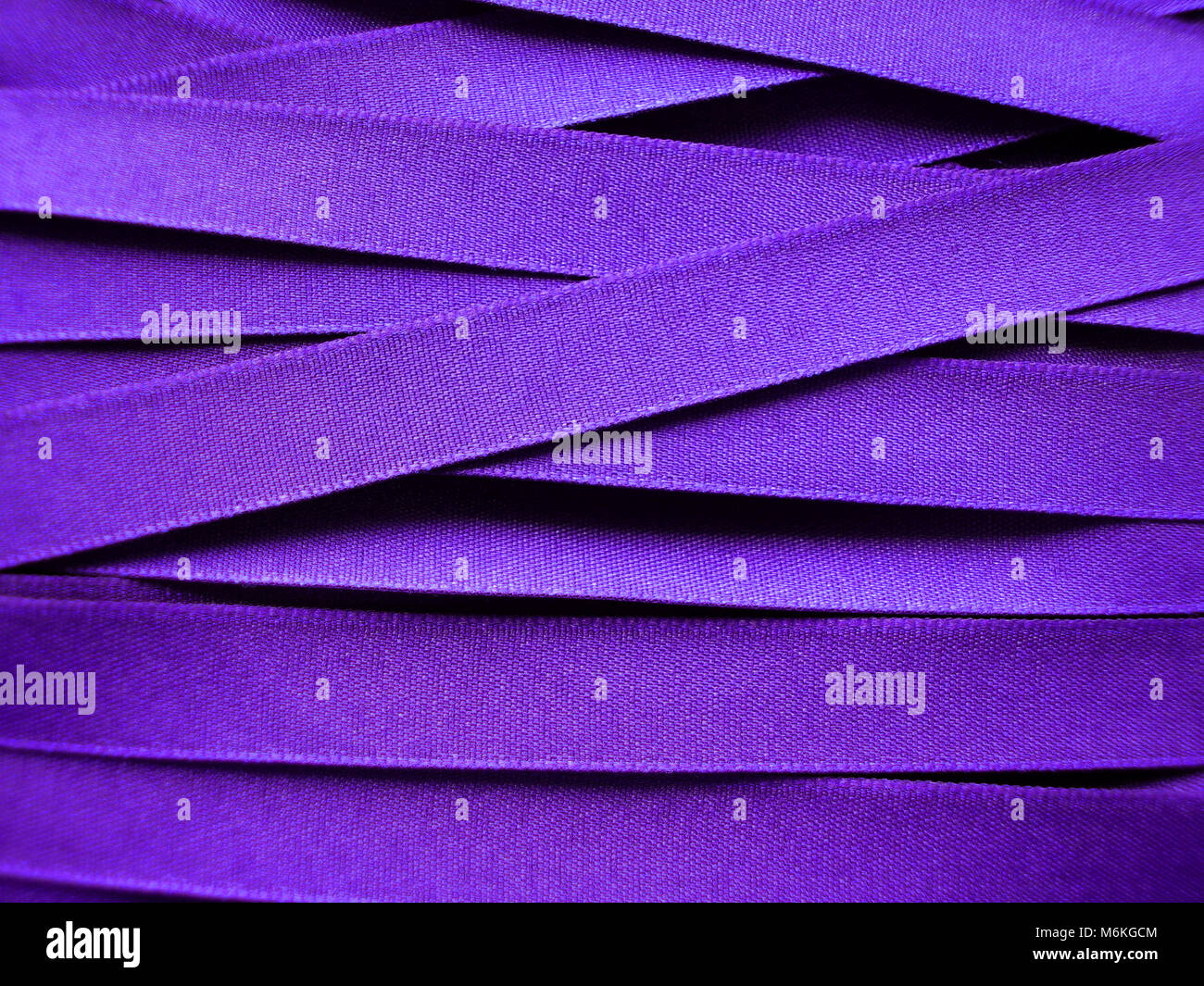 Shiny Purple satin ribbon background Stock Photo - Alamy
