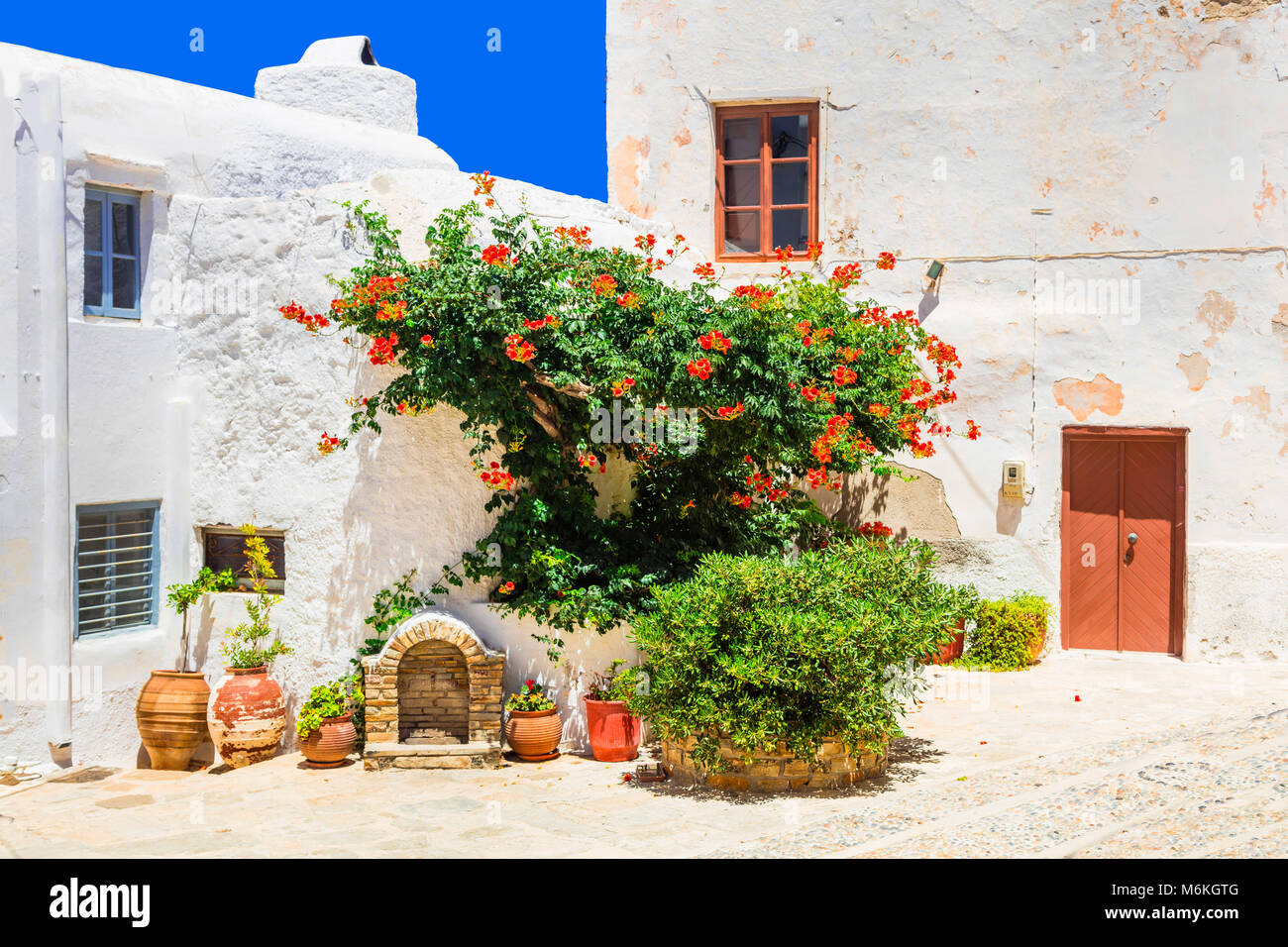 Old streets of Greece,view withf door,windows and floral decoration,naxos. Stock Photo