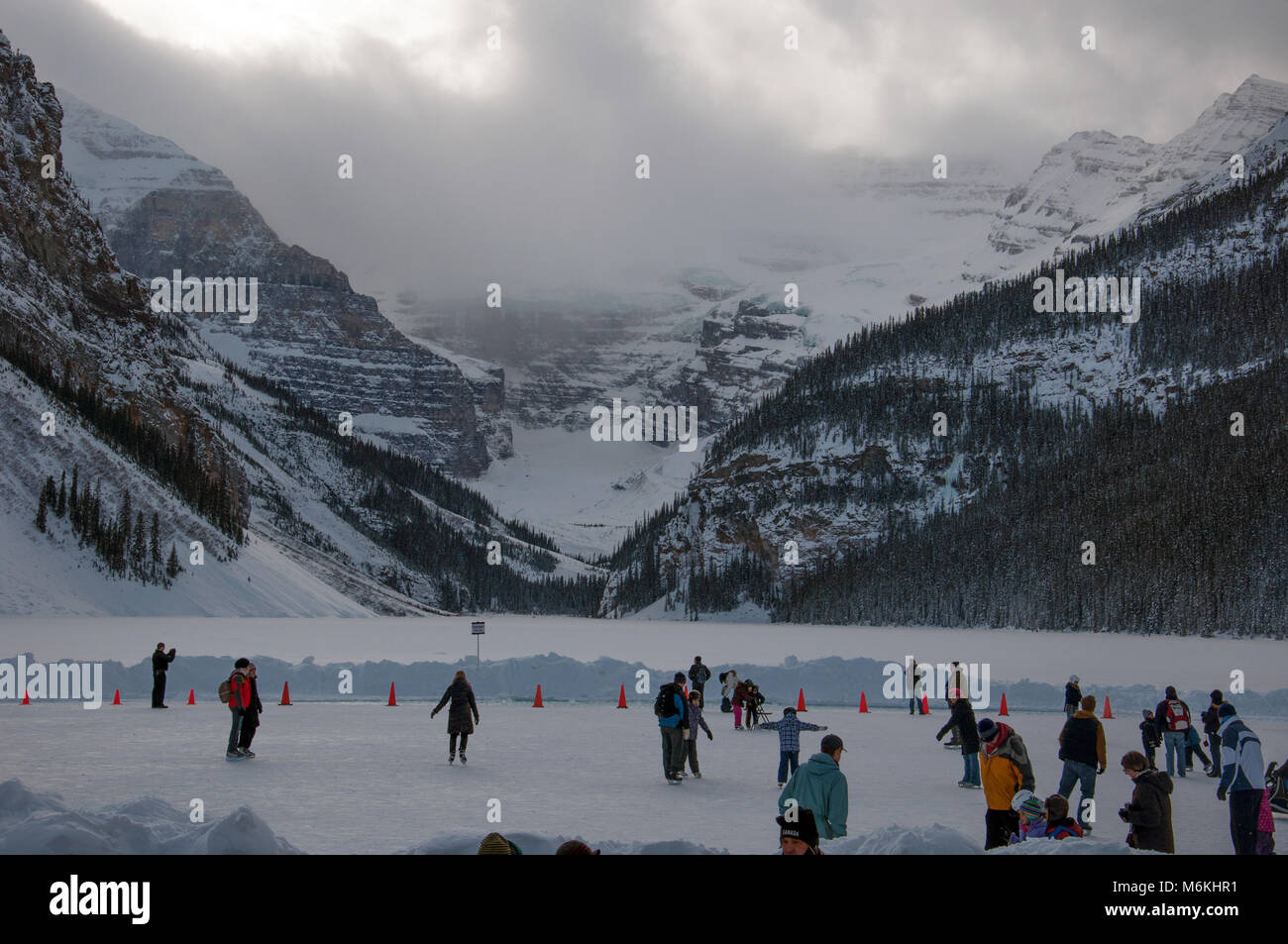 Children and Families ice skating and playing pond hockey on Lake Louise,  Banff National Park, Alberta, Canada, January 22, 2011 Stock Photo - Alamy