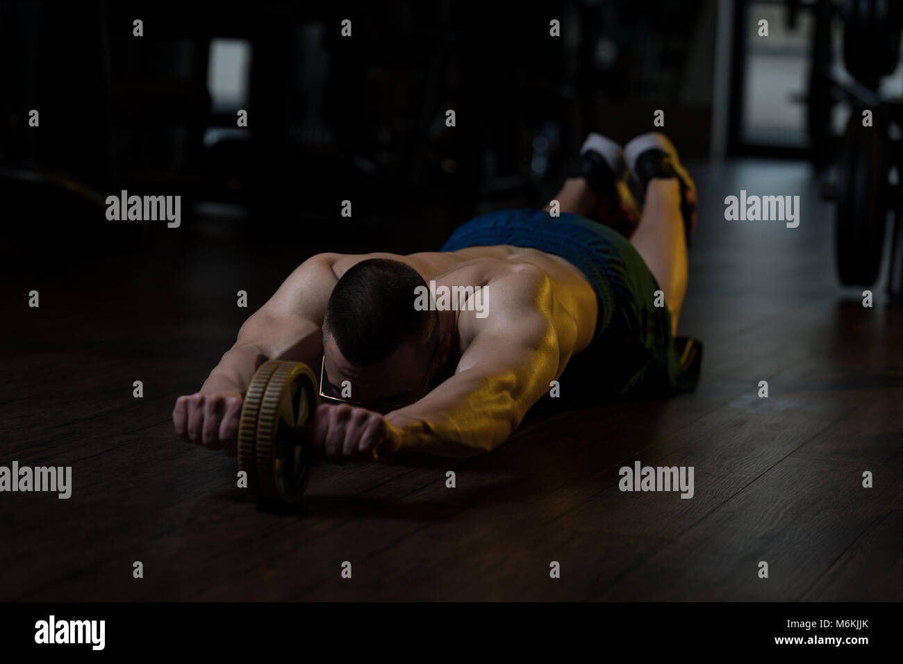 Young Man Wearing Glasses Exercising Fitness Workout For Abdominal With