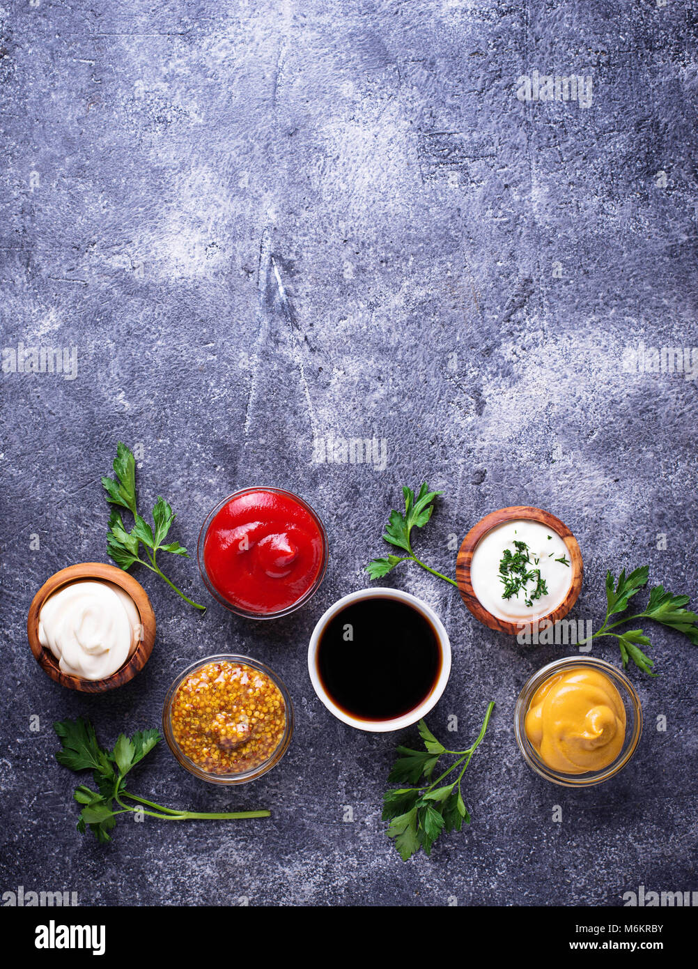 Set of different sauces. Ketchup, mayonnaise, mustard, soy sauce and