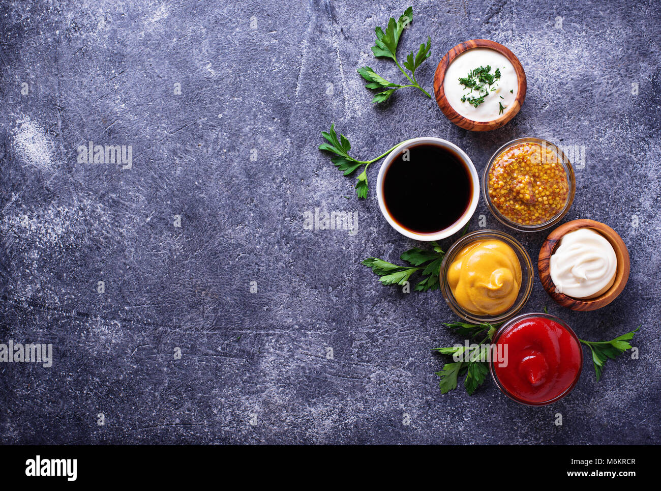 Set of different sauces. Ketchup, mayonnaise, mustard, soy sauce and