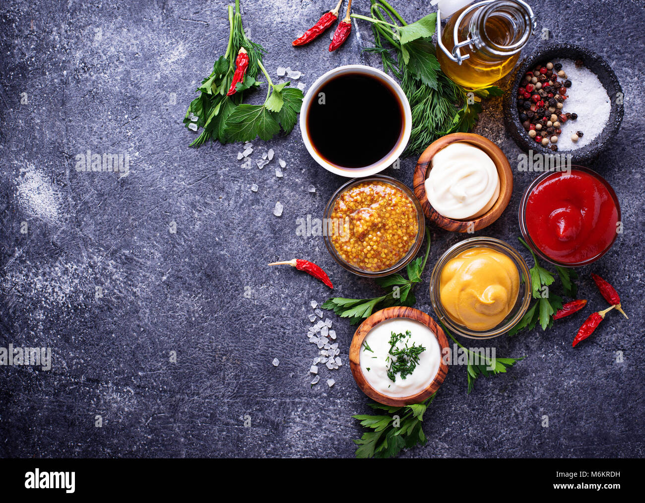 Set of different sauces. Ketchup, mayonnaise, mustard, soy sauce and