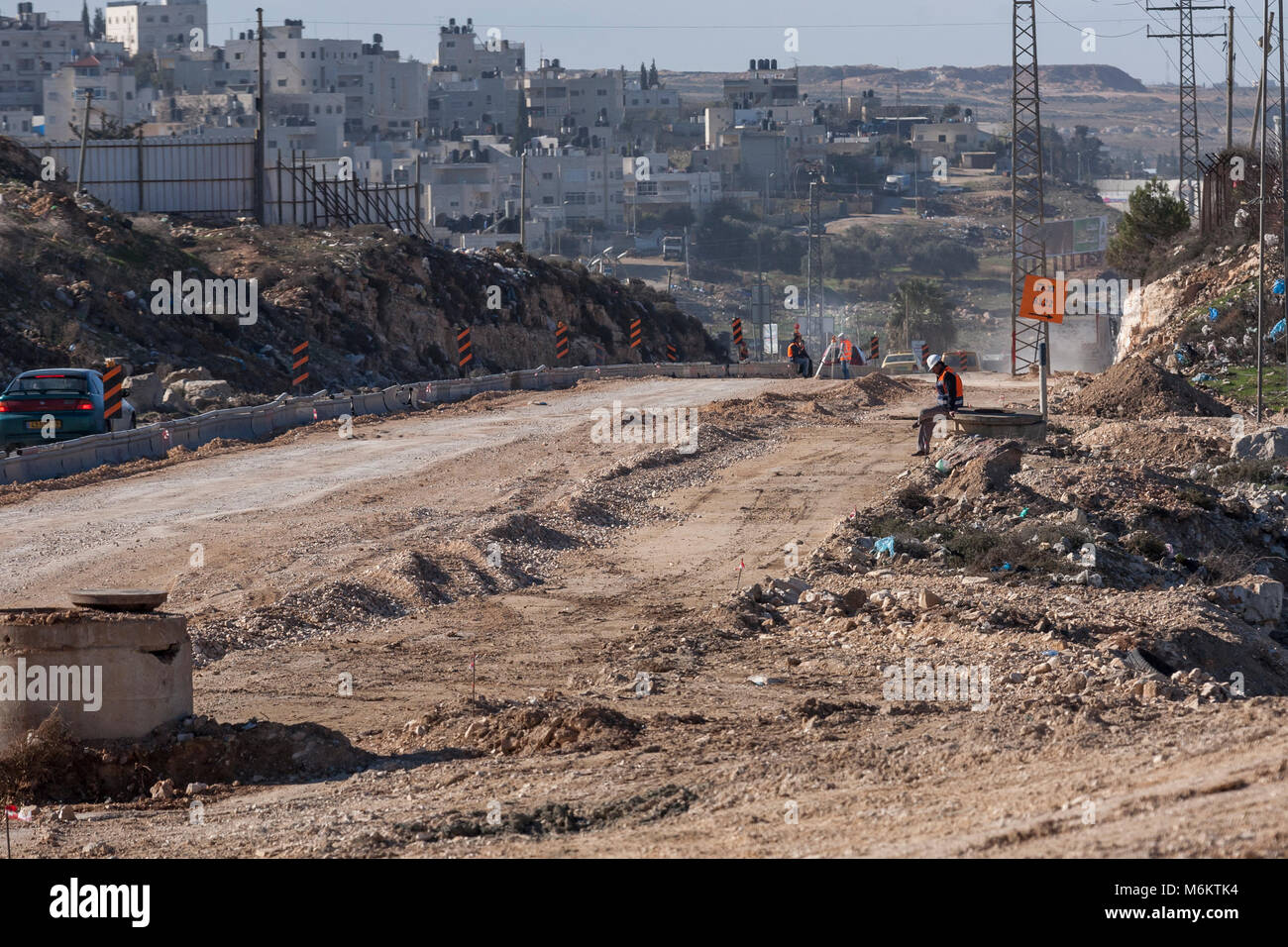 Ram, Palestine, January 12, 2011 Workers are building a new road in