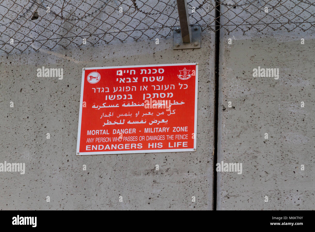 Jerusalem, Israel, November 23, 2010: Warning sign by the concrete wall ...