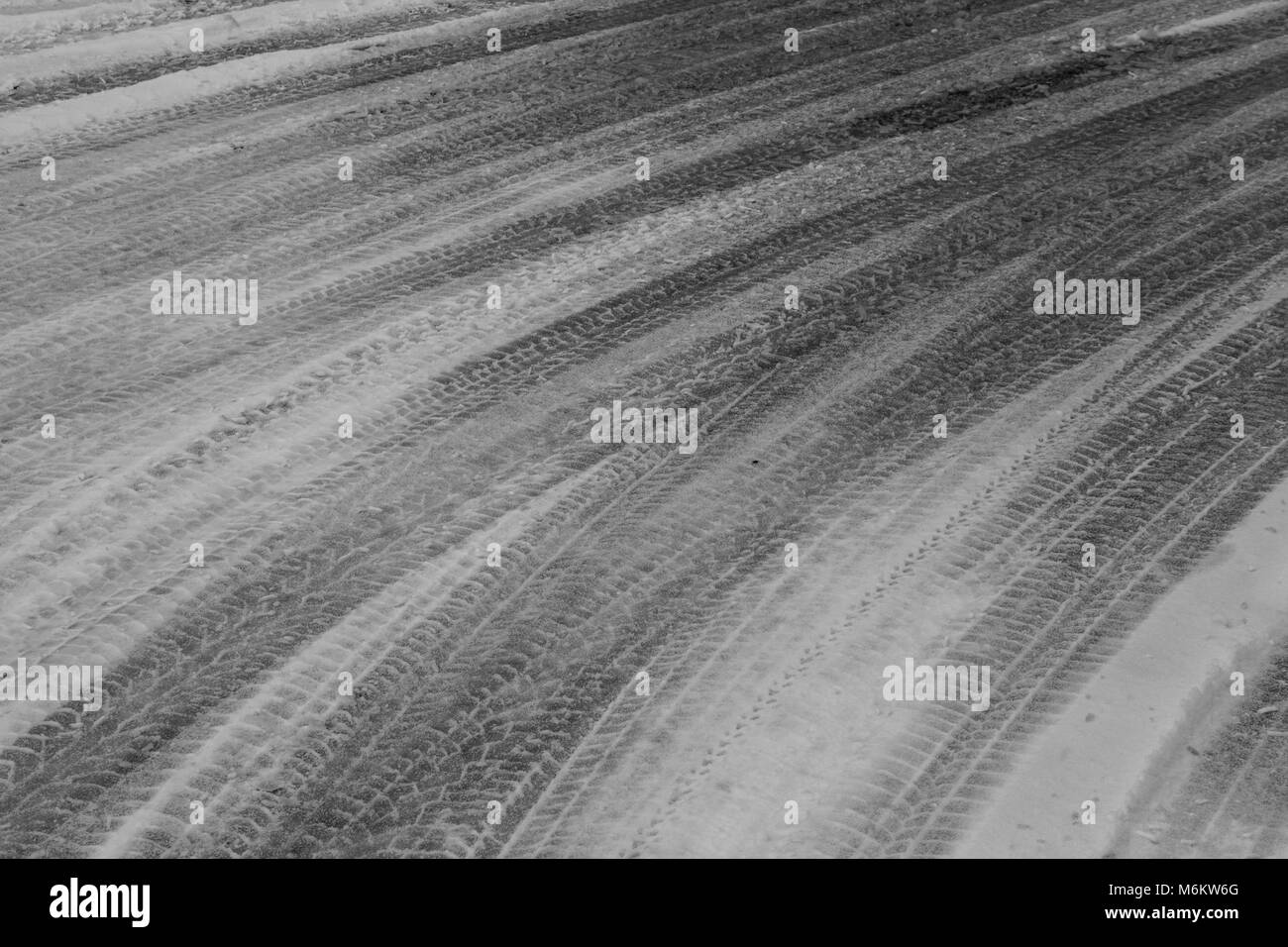 Car Traces In The Snow Stock Photo - Alamy