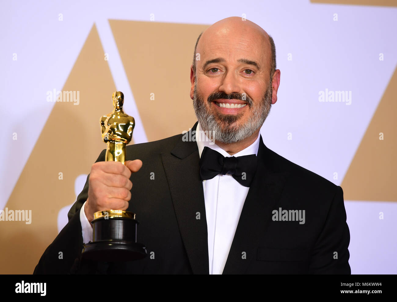 Mark Bridges with his oscar for Best Costume Design in Phantom Thread in  the press room at the 90th Academy Awards held at the Dolby Theatre in  Hollywood, Los Angeles, USA Stock