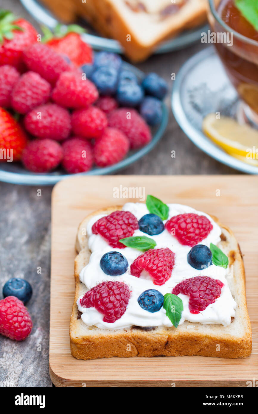toast with cream cheese and fresh berries Stock Photo Alamy