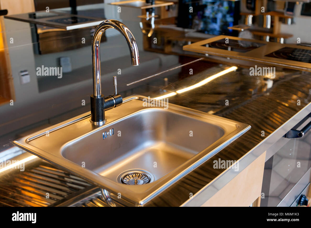Beautiful mettalic sink in a modern kitchen Stock Photo - Alamy