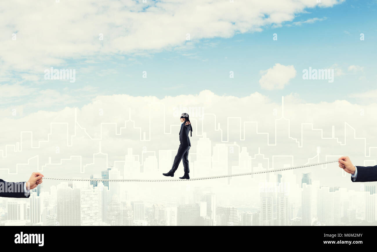 Business concept of risk support and assistance with man balancing on ...