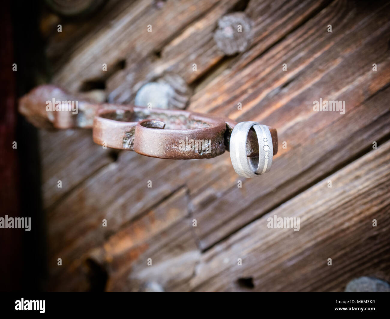 the wedding rings at the old church door Stock Photo
