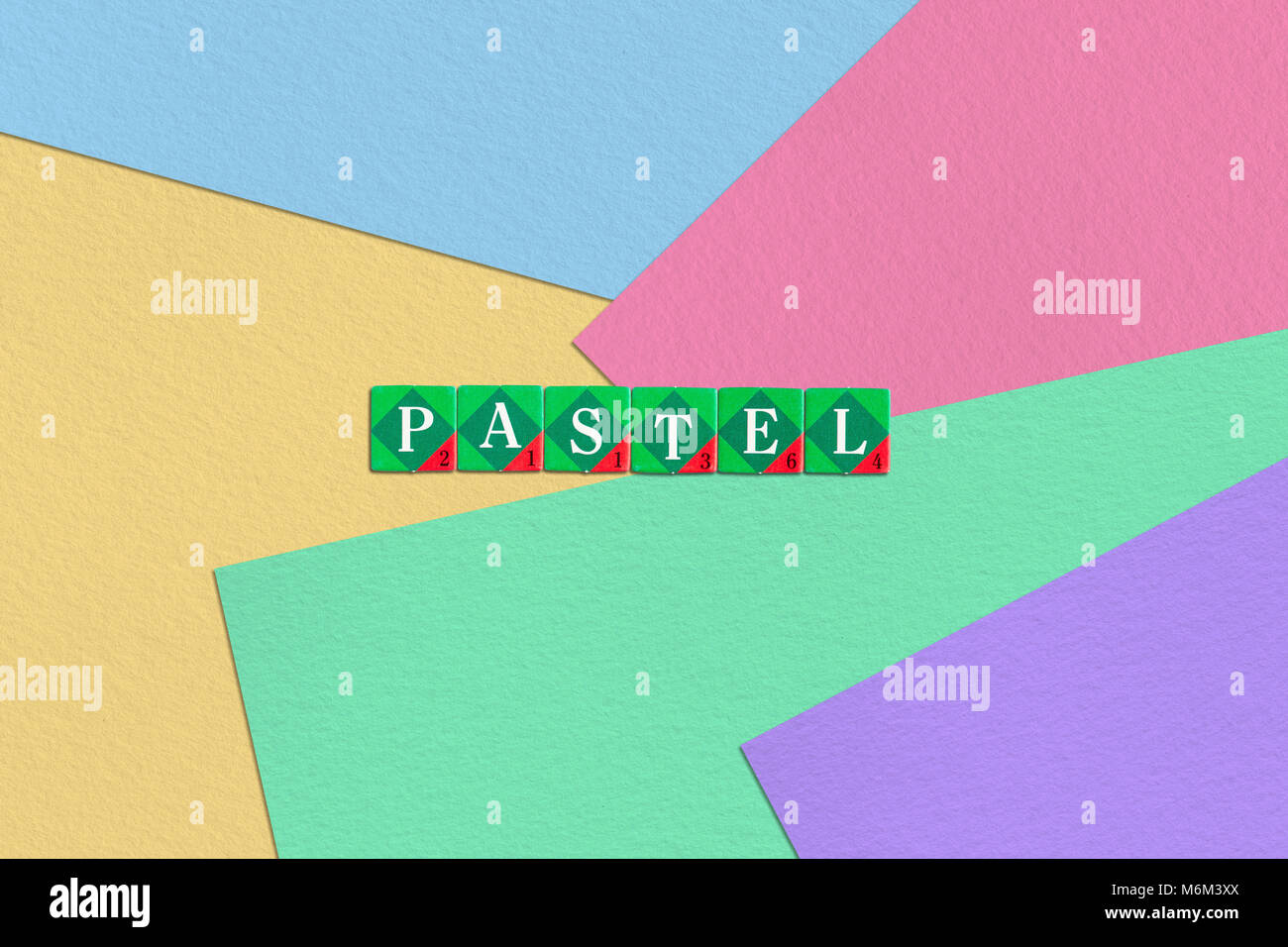 Scrabble letters spelling word Pastel on colorful pastel paper