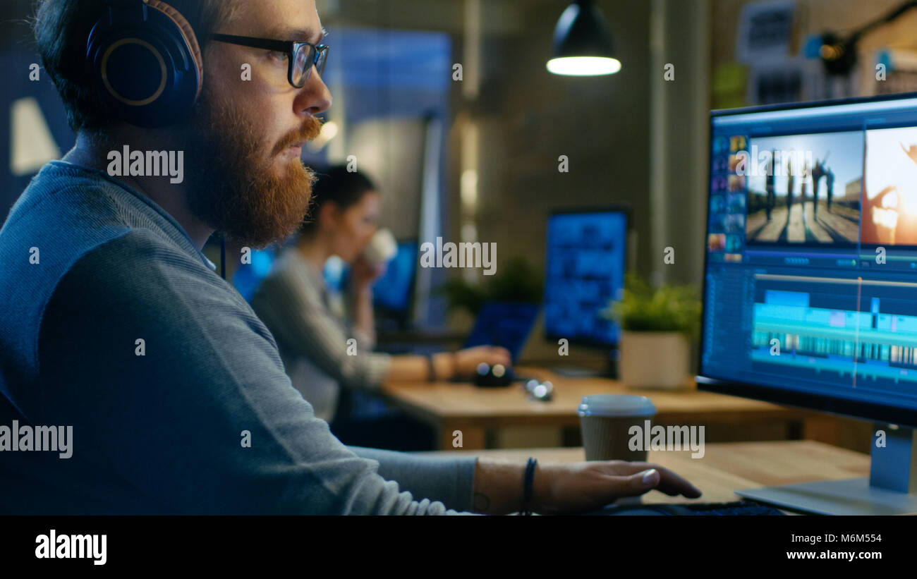 Male Videographer Edits and Cuts Footage and Sound on His Personal