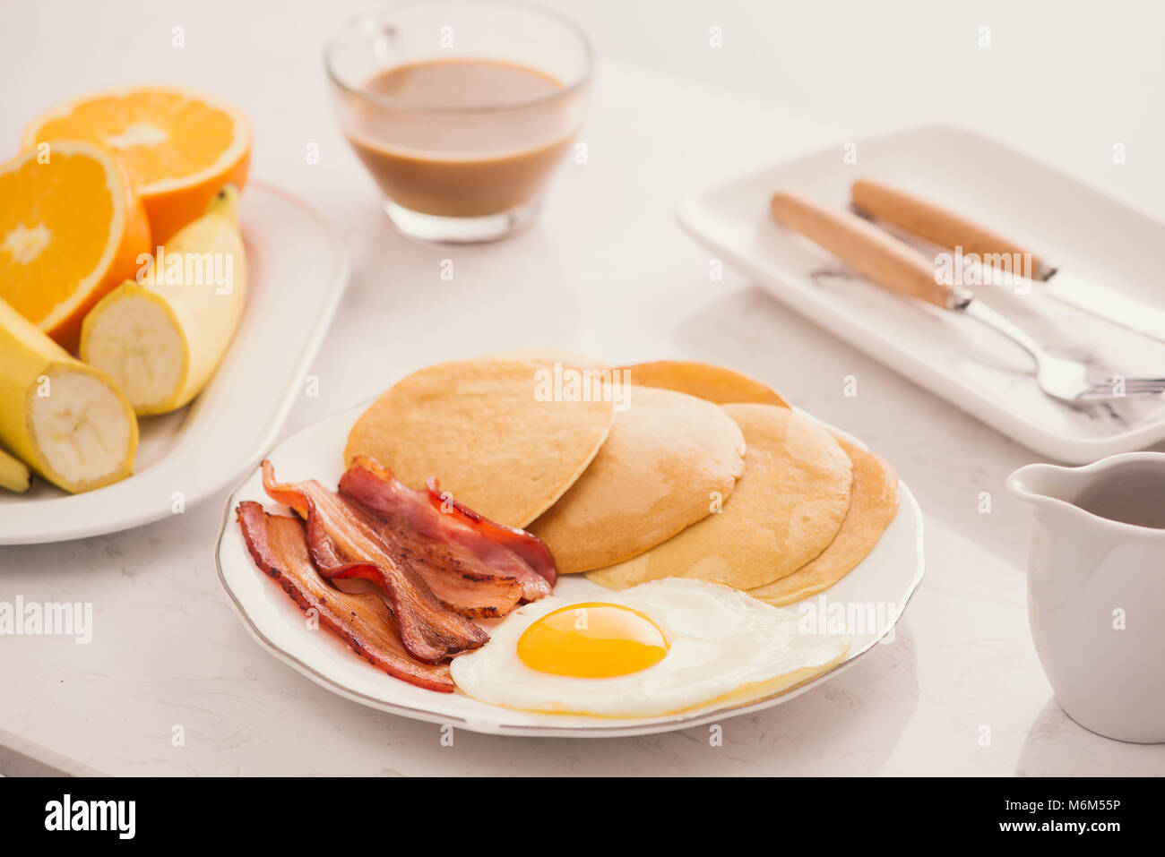 Breakfast plate with pancakes, eggs, bacon and fruit Stock Photo Alamy
