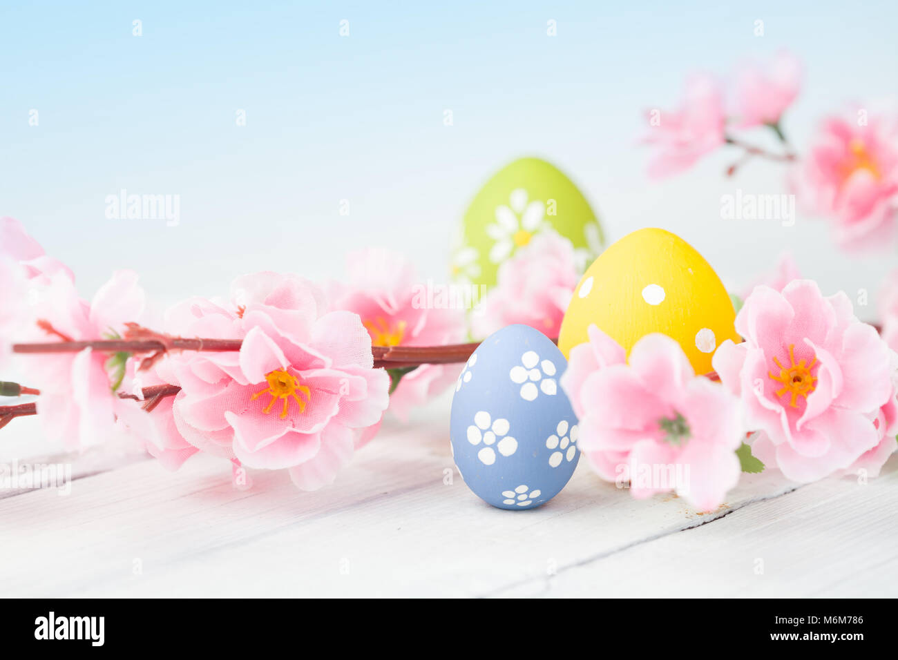 Easter eggs on blue wooden background Stock Photo