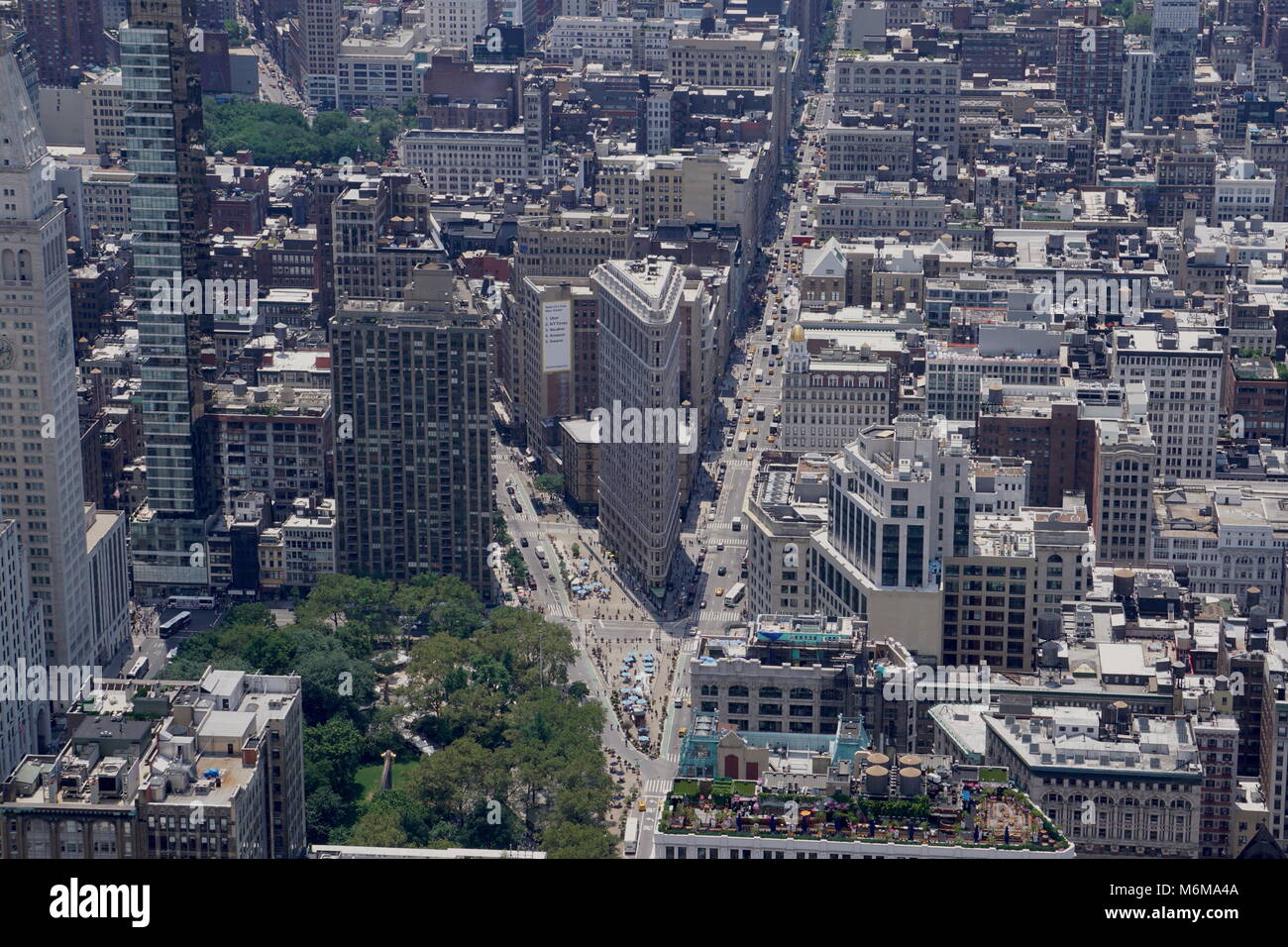 New York City, NY - July 12 2016: Wide aerial rooftop view of the famous flatiron building on Broadway in midtown Manhattan on a clear summer day Stock Photo
