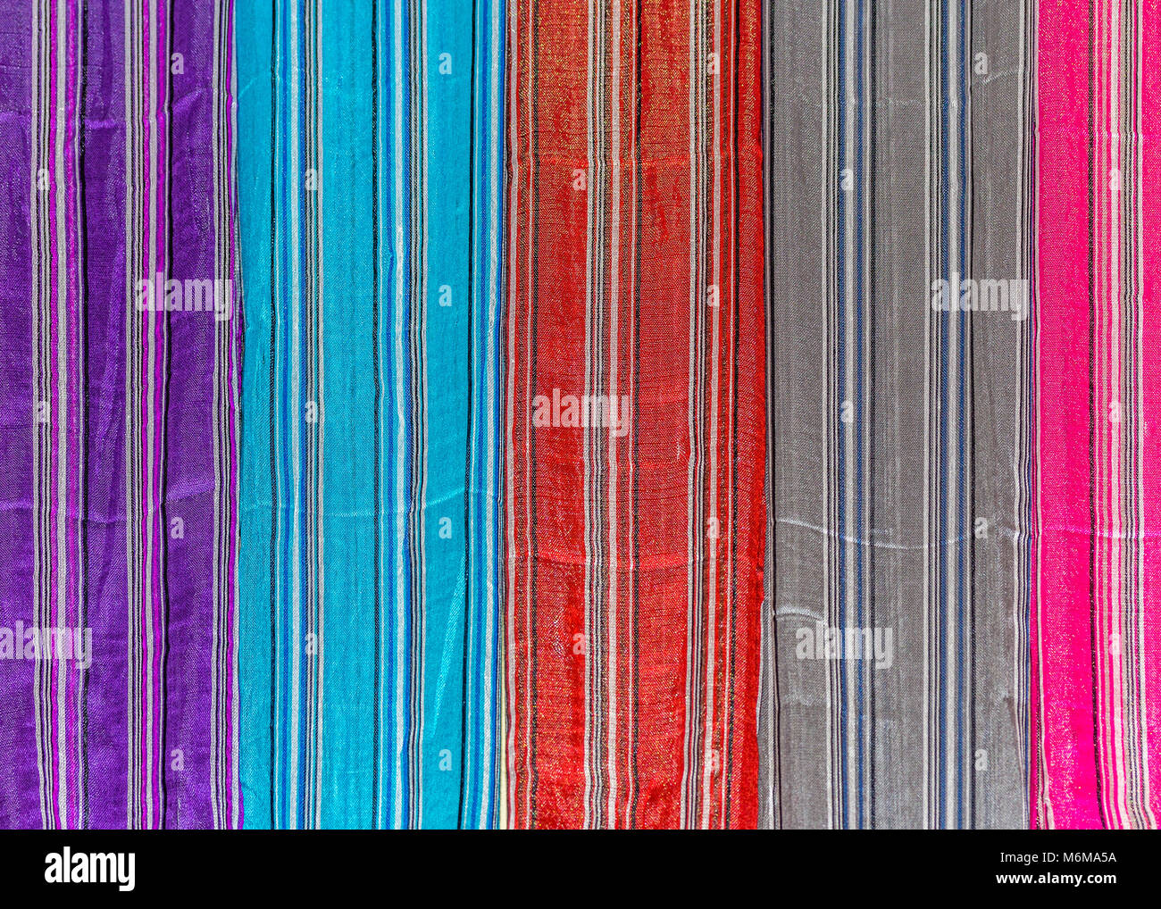 Colourful striped silk scarves for sale in the Medina, Fez, Morocco . Stock Photo