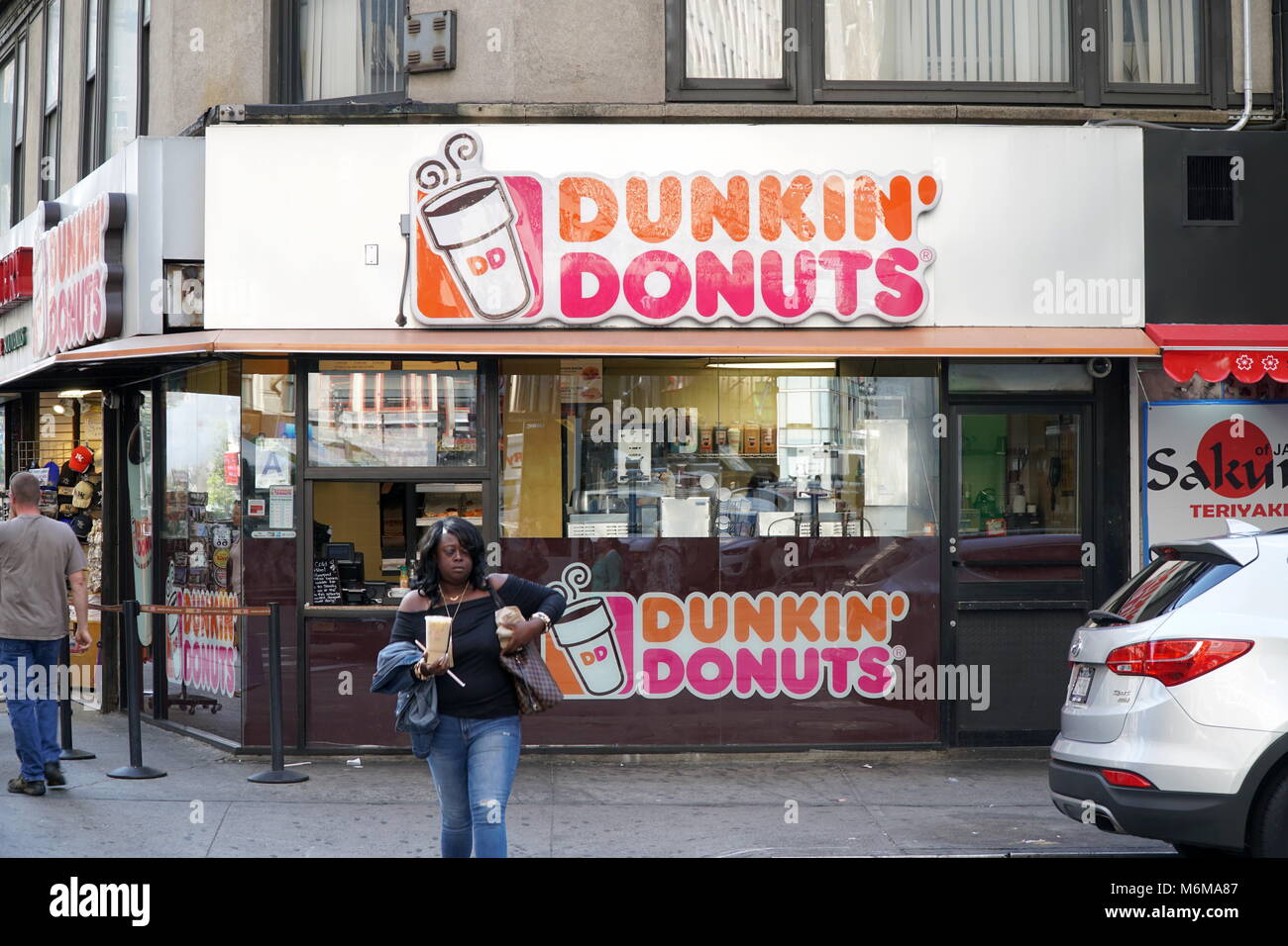 New York City - September 2016: Dunkin Donuts coffee shop on the corner of a Manhattan street Stock Photo