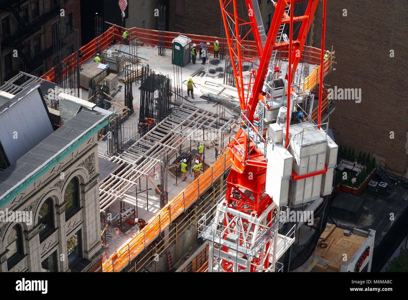 Large construction site in New York City as union labor workers erect a ...