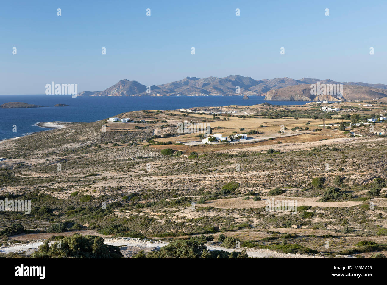 View along north coast of island with Kimolos behind, near Mytakas, Milos, Cyclades, Aegean Sea, Greek Islands; Greece; Europe Stock Photo